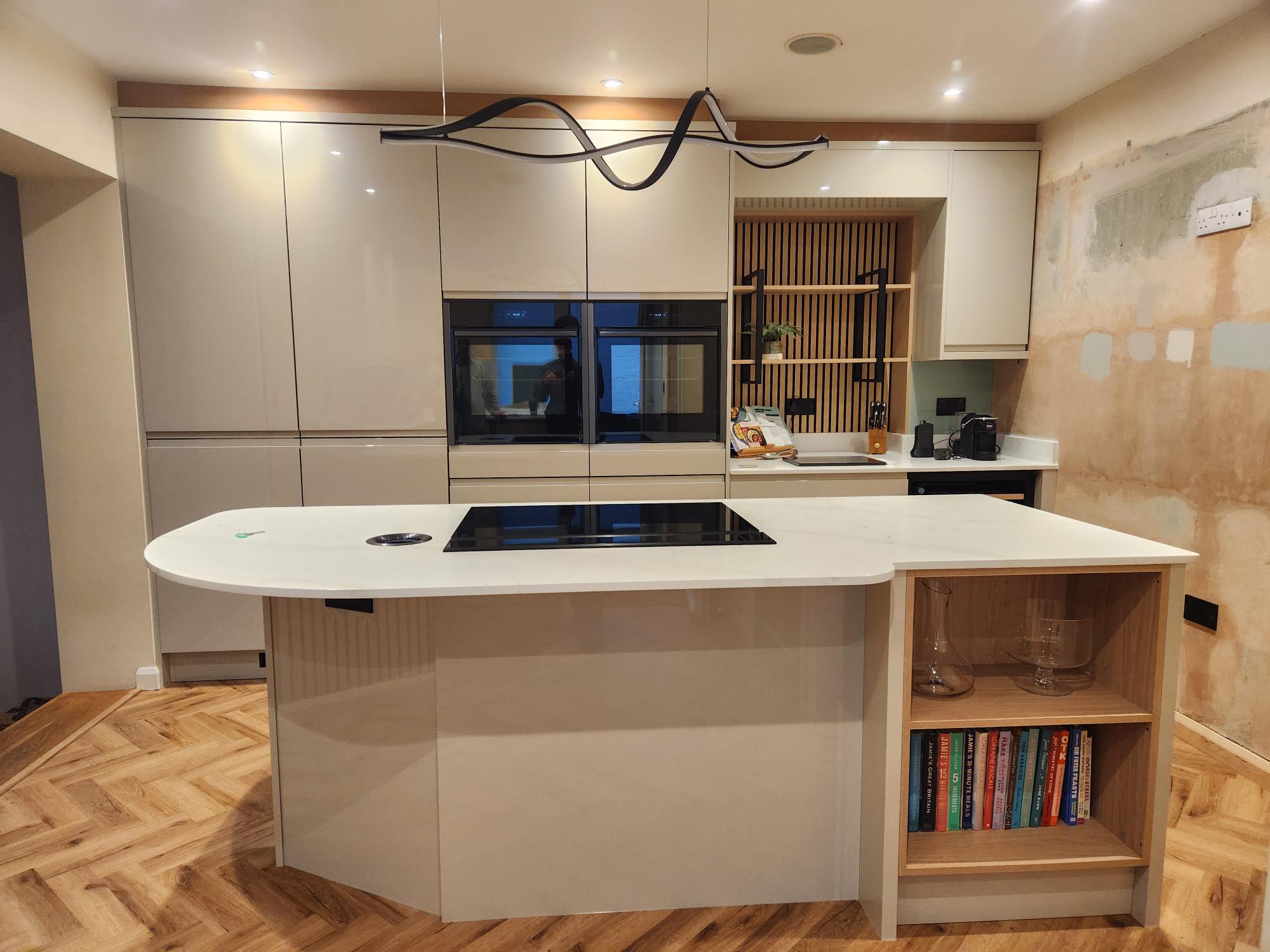 Modern handleless kitchen with designer lighting